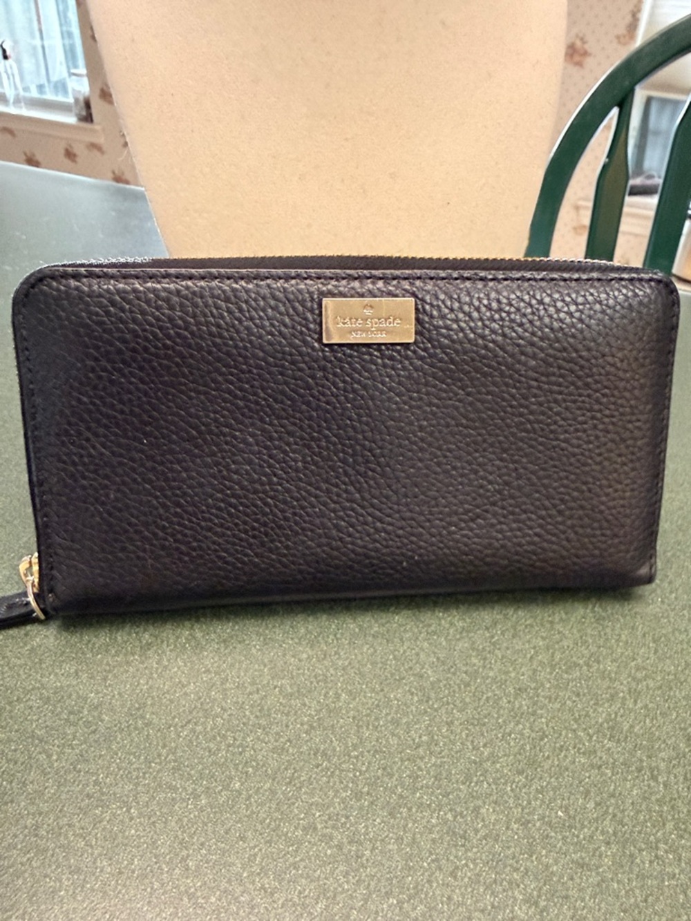 kate spade black pebbled leather zip-around wallet with gold plaque